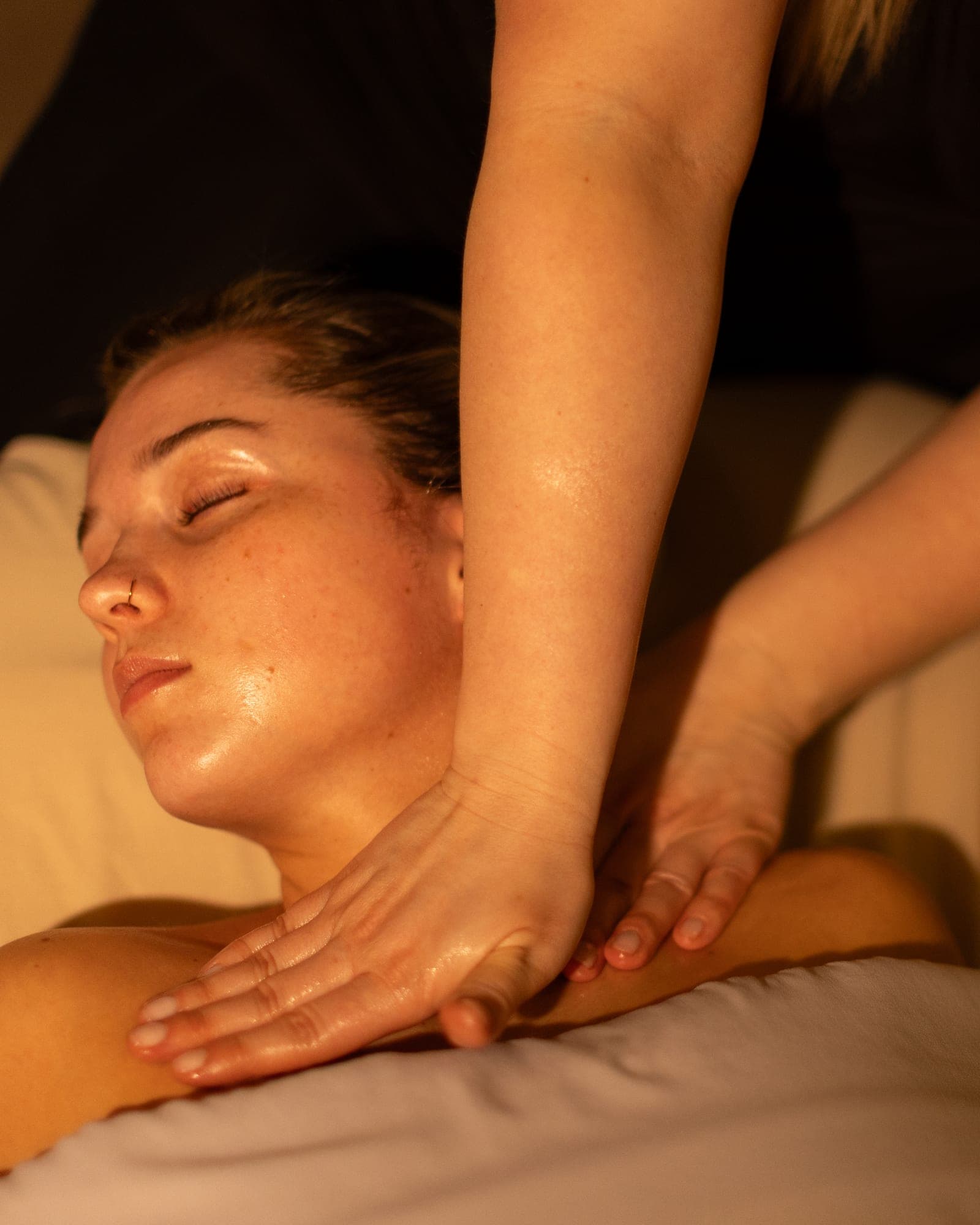 Esthetician performing a Neck & Décolleté enhancement on a guest at The Spa on Phillips